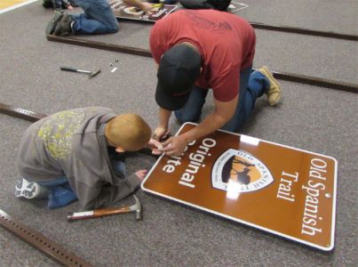 Volunteers and Boy Scouts prepare signs in Iron County, Utah. Photo courtesy St. George News. Utah